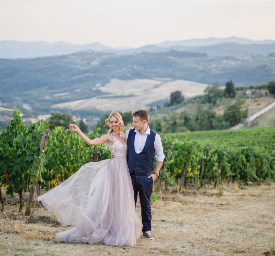 Wedding couple posing in a vineyard
