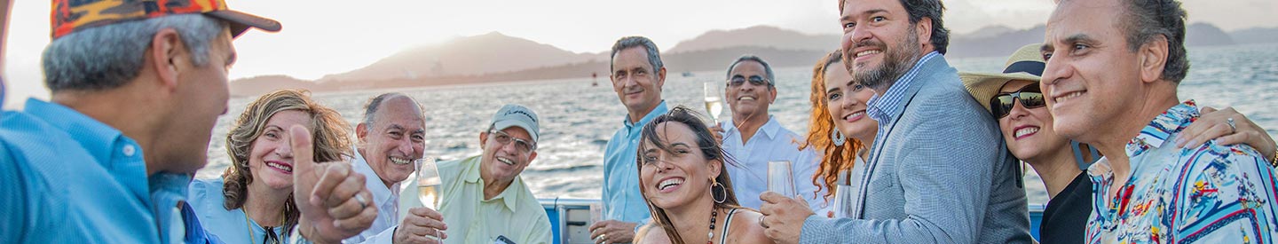 Group of middle aged friends on boat taking a picture