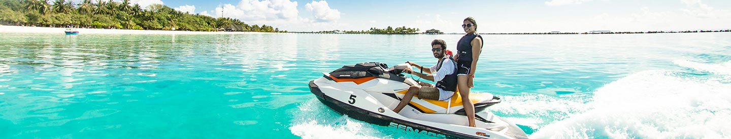 Couple on a jet ski in tropical waters