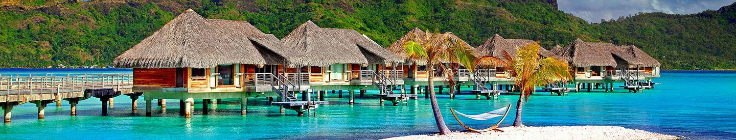 Tropical vacation huts on the water
